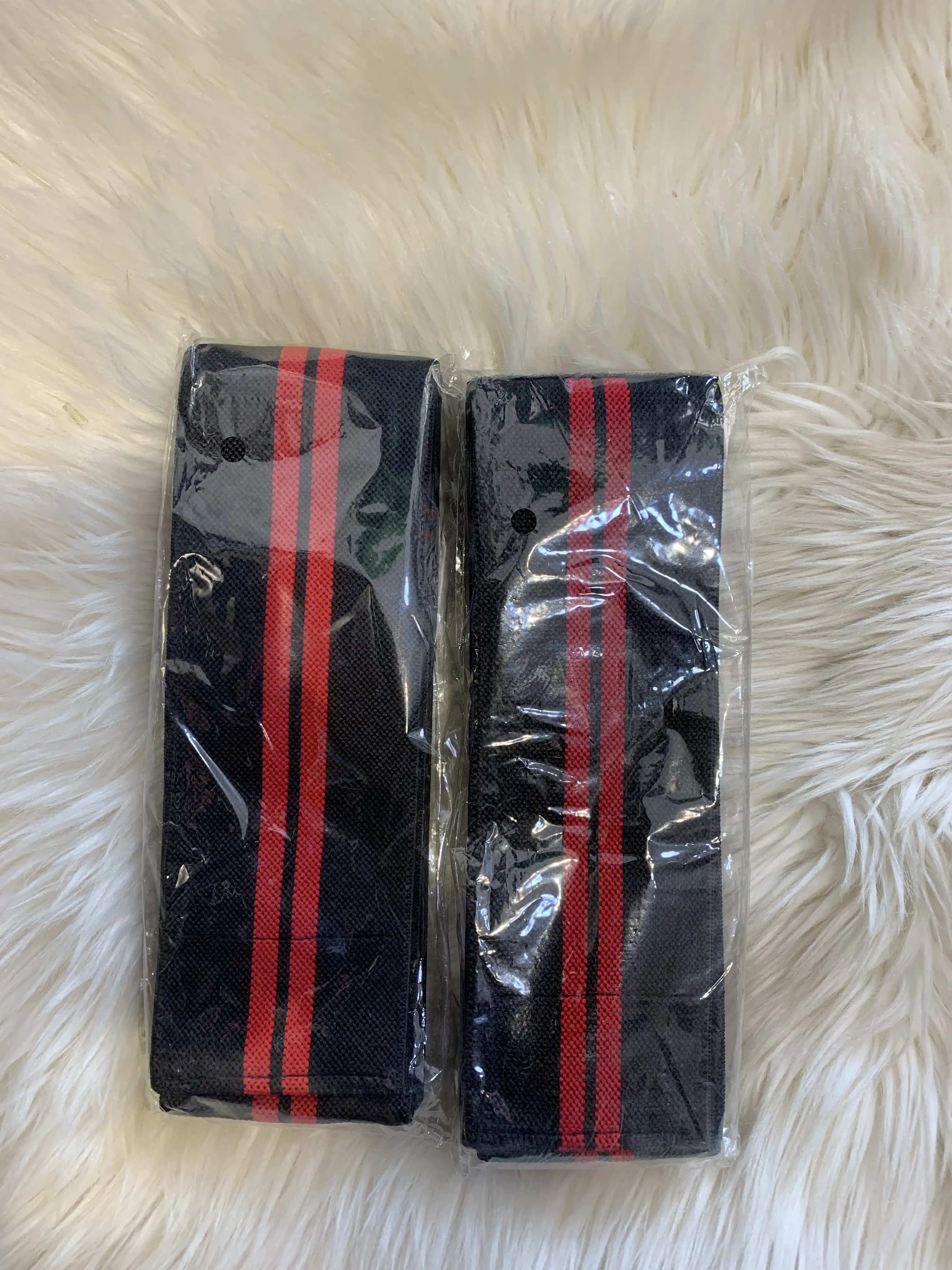 Massaging Knee Wrap (Black and Red) image by Muscly Fitness Shop
