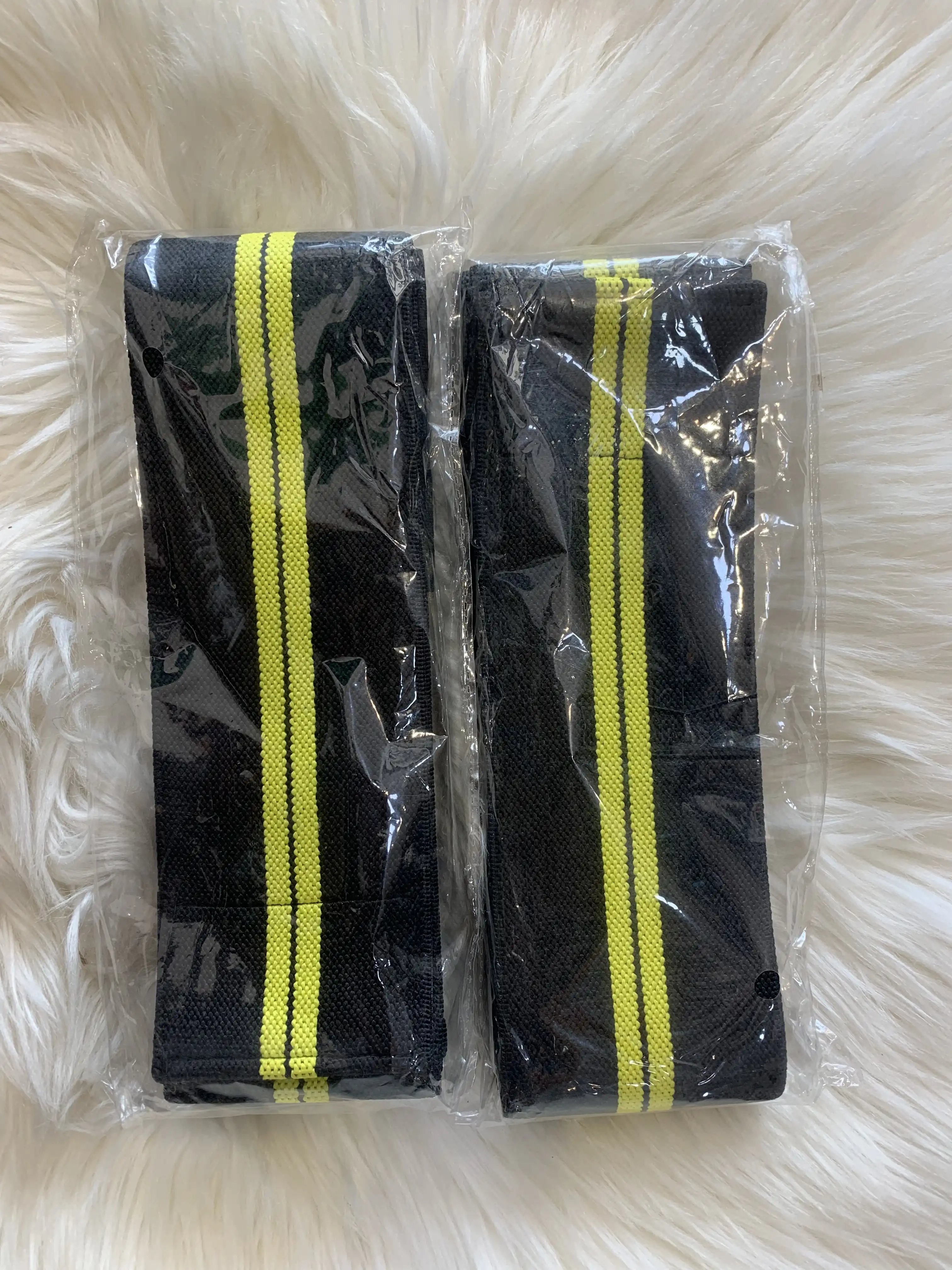 Massaging Knee Wrap (Black and Yellow) image by Muscly Fitness Shop